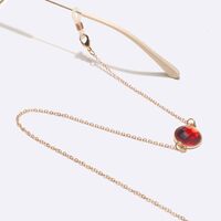 Gold-colored metal non-slip chain, with red crystals, for glasses and masks GL1604