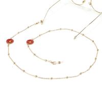 Gold-colored metal non-slip chain, with red daisy, for glasses and masks GL1031