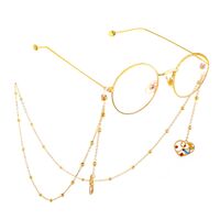 Gold-colored metal non-slip chain, with pendant heart with beads, for glasses and masks GL578
