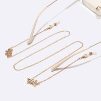 Gold-colored metal non-slip chain, with butterfly with rhinestines, for glasses and masks GL1456