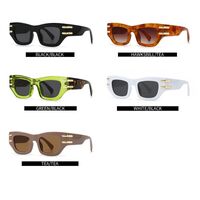 Plastic sunglasses in the shape of a 