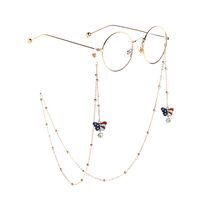 Gold-colored metal non-slip chain, with beads and butterfly, for glasses and masks GL818