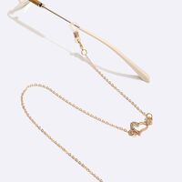 Gold-colored metal non-slip chain, with heart and rhinestones, for glasses and masks GL1524
