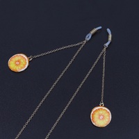 Gold-colored metal non-slip chain, with pendant orange, for glasses and masks GL657