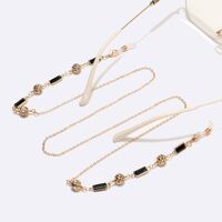 Gold-colored metal non-slip chain, with black squares and rhinestone beads, for glasses and sweater GL1527