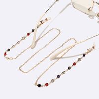 Gold-colored metal non-slip chain, with colored rhinestones, for glasses and masks GL1550
