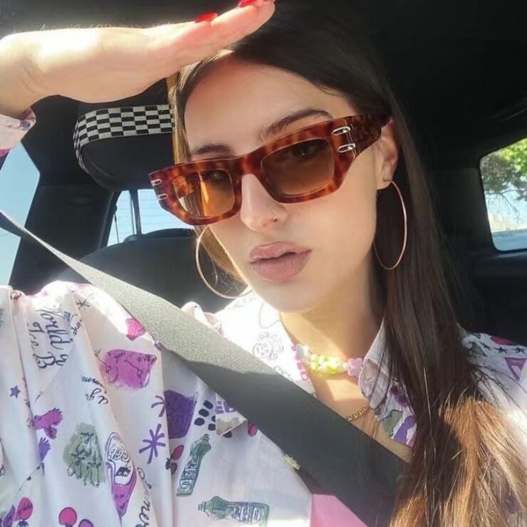 Plastic sunglasses in the shape of a 