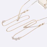 Gold-colored metal non-slip chain, with pearl 8 mm, for glasses and masks GL1453