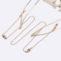 Gold-colored metal non-slip chain, with black rhinestone and pearls, for glasses and masks GL1562