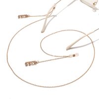 Gold-colored metal non-slip chain, with letters Kiss with rhinestone, for glasses and masks GL1444
