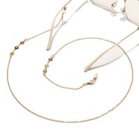 Gold-colored metal non-slip chain, with colored daisy, for glasses and masks GL1447