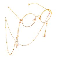 Gold-colored metal non-slip chain, with pendant leaf and pearl, for glasses and masks GL548