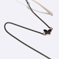 Black-colored metal non-slip chain, with pendant butterfly, for glasses and masks GL1500