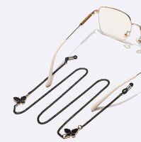 Black-colored metal non-slip chain, with pendant butterfly, for glasses and masks GL1500