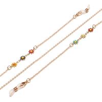 Gold-colored metal non-slip chain, with colored daisy, for glasses and masks GL1447