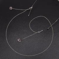 Gold-colored metal non-slip chain, with pendant pink crystal, for glasses and masks GL563