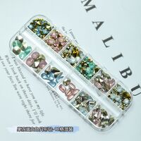 A set of rhinestones with a point bottom for decorating frames and glasses, 12 boxed,果冻蛋白色异形钻12格混装 (price per pack, minimum 3)