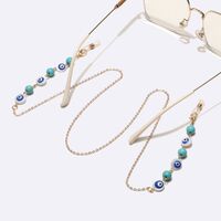 Gold-colored metal non-slip chain, with turquoise beads and blue eyes, for glasses and masks GL1741