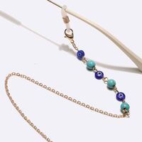 Gold-colored metal non-slip chain, with turquoise beads and eyes, for glasses and masks GL1735