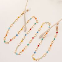 Gold-colored metal non-slip chain, with rectangular and colored crystal, for glasses and masks GL1858