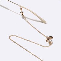 Gold-colored metal non-slip chain, with a bow and pearls, for glasses and masks GL1547
