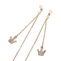 Gold-colored metal non-slip chain, with crown pendant with rhinestones, for glasses and masks GL1510