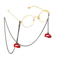 Black-colored metal non-slip chain, with pendant red lips, for glasses and masks GL626