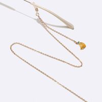 Gold-colored metal non-slip chain, with banana pendant, for glasses and masks GL1497