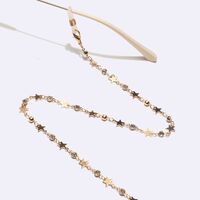 Gold-colored metal non-slip chain, with star and rhinestone, for glasses and masks GL1624