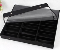 Sunglasses holder display with 18 slots, black with a black lining