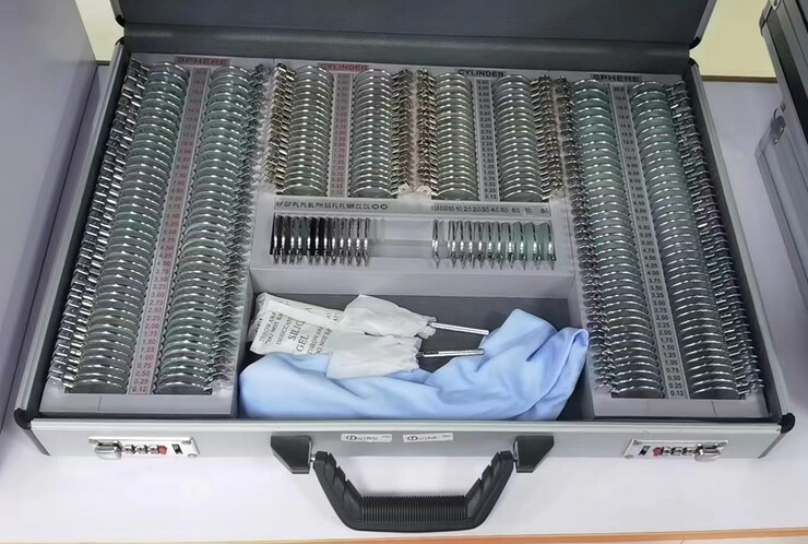 232 metal rim ophthalmic trial lens set in an aluminum case