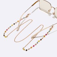 Gold-colored metal non-slip chain, with colored cristal, for glasses and masks GL1579