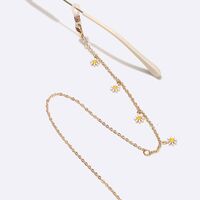 Gold-colored metal non-slip chain, with white daisy, for glasses and sweater GL1552