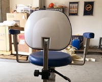 Surgical stool, operating chair rotating on wheels with lift for the ophthalmologist's office DTL16 with armrests 
