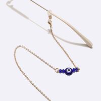 Gold-colored metal non-slip chain, with gold crystals and blue eyes, for glasses and masks GL1733